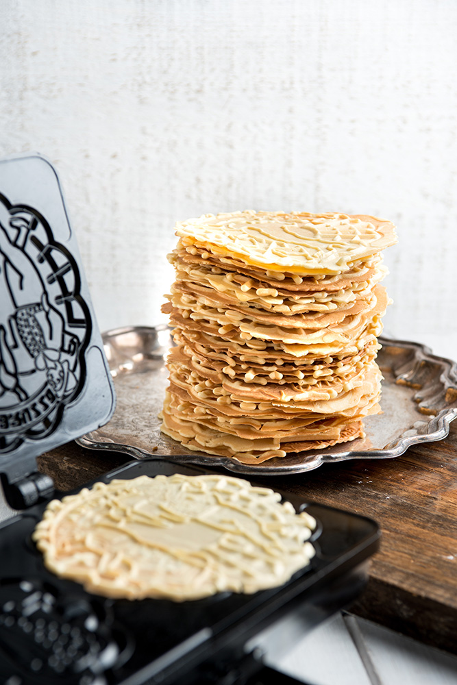 tall pile of fresh pizzelle - cookie photographer